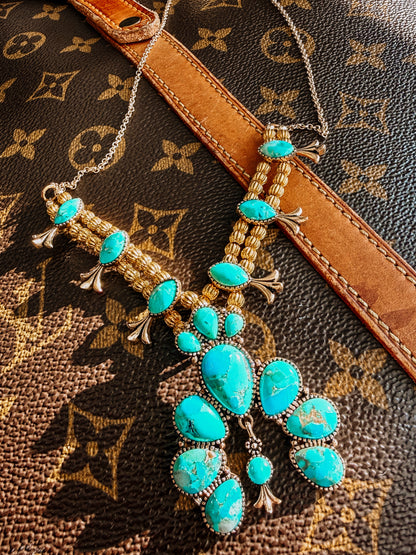 Squash Blossom Statement
Blue Turquoise Golden Necklace