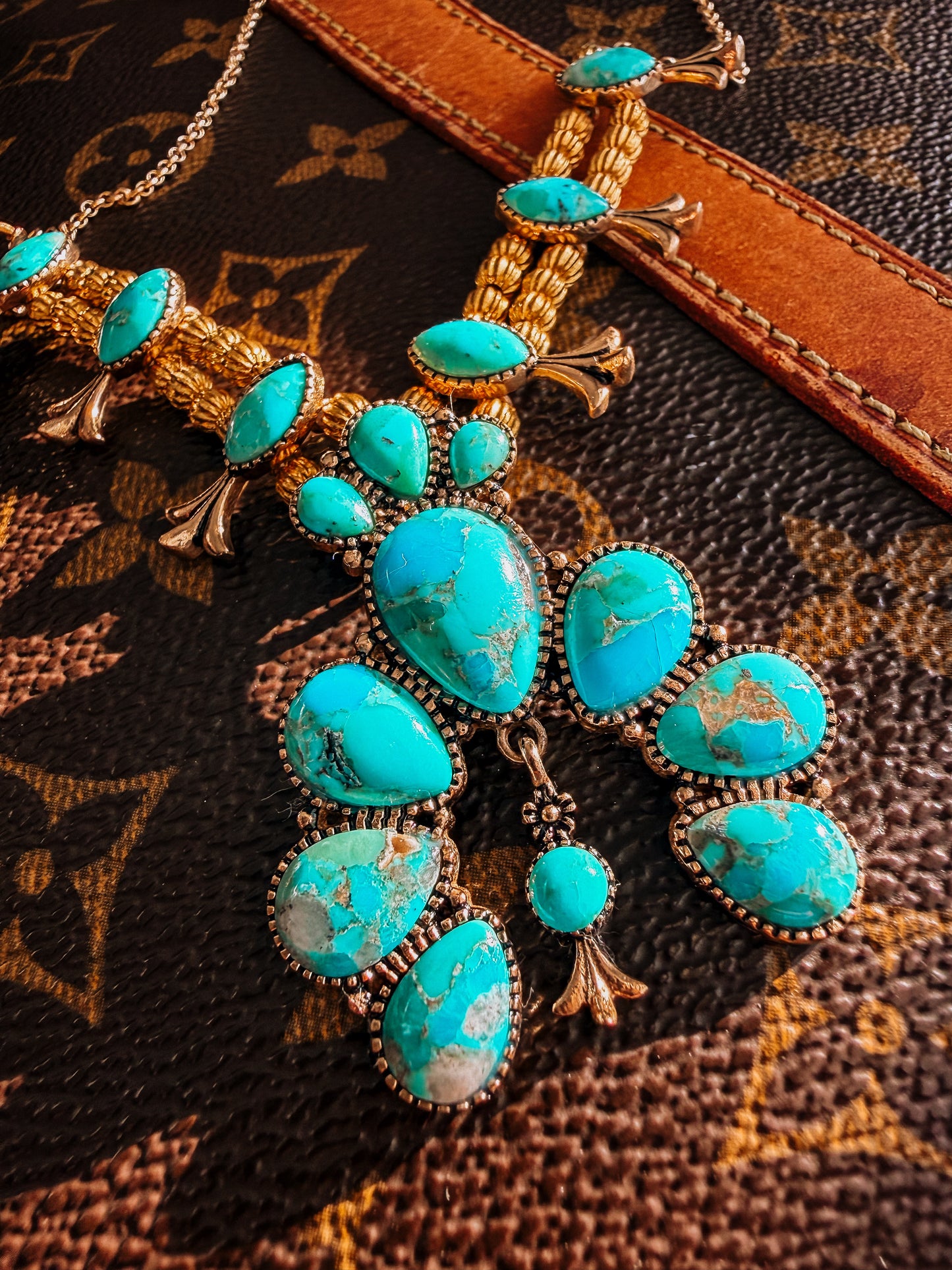 Squash Blossom Statement
Blue Turquoise Golden Necklace
