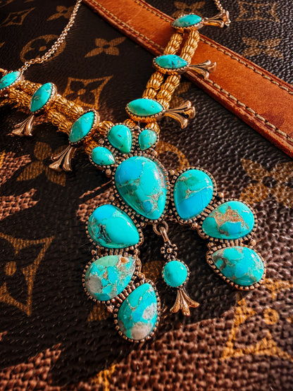 Squash Blossom Statement
Blue Turquoise Golden Necklace