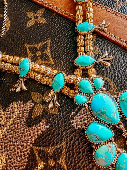 Squash Blossom Statement
Blue Turquoise Golden Necklace